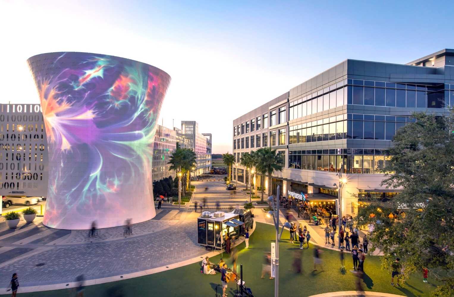 Large white sculpture in the center of a city, standing out in a familiar setting in Orlando.