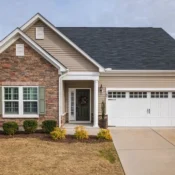 White single-family home with a garage and garden in Orlando, Florida.